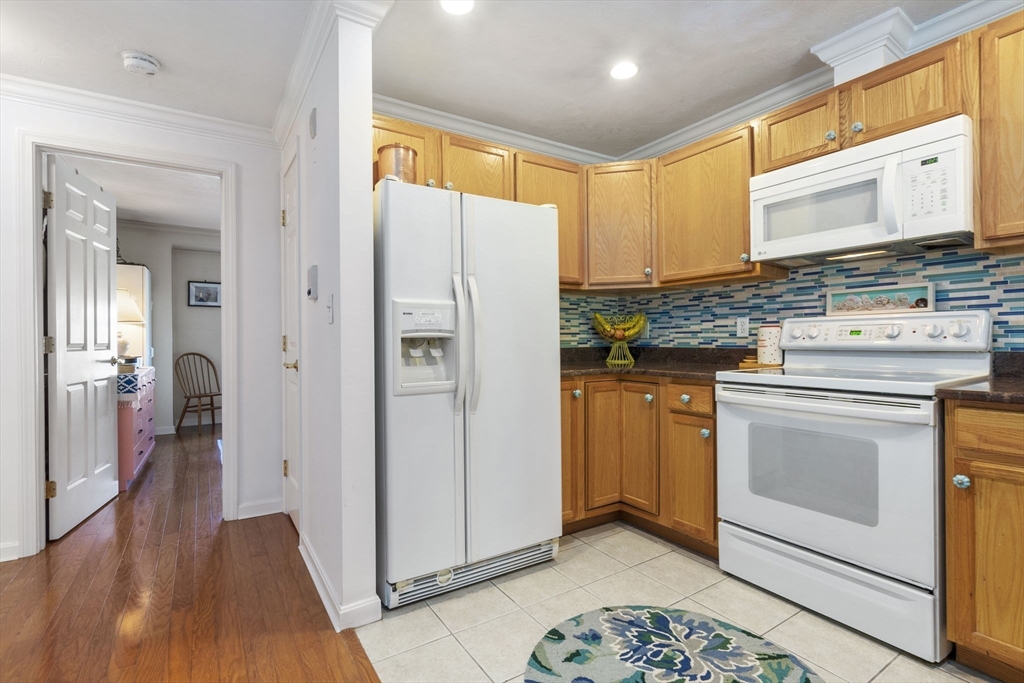 35 Collins Street, Unit 75 Danvers, MA 01923 - Photo 17 of 31 a kitchen with a refrigerator stove and sink