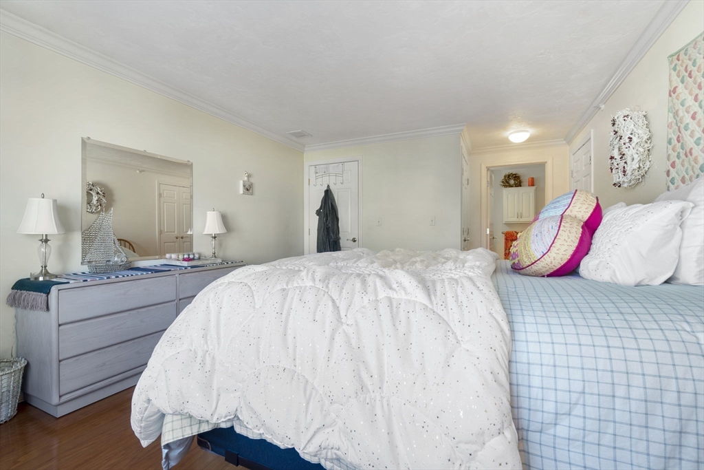 35 Collins Street, Unit 75 Danvers, MA 01923 - Photo 21 of 31 a bedroom with a bed and a dresser