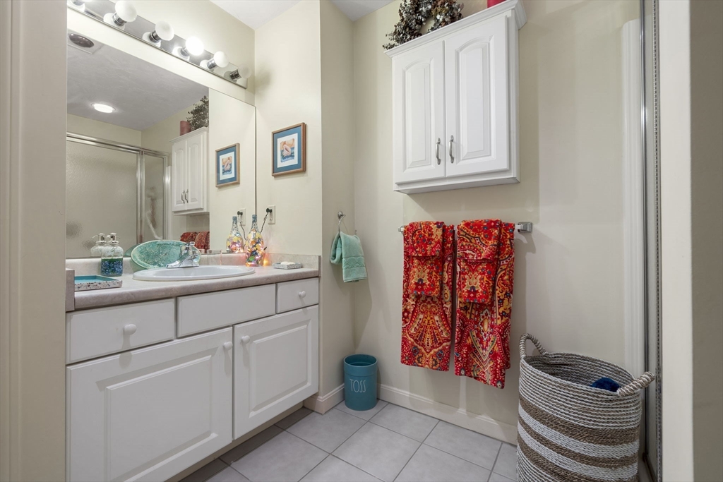 35 Collins Street, Unit 75 Danvers, MA 01923 - Photo 23 of 31 a bathroom with a sink and a mirror