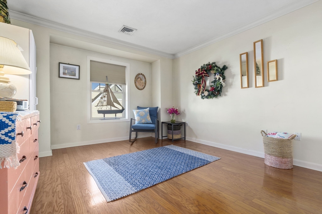 35 Collins Street, Unit 75 Danvers, MA 01923 - Photo 24 of 31 a living room with furniture and a wooden floor
