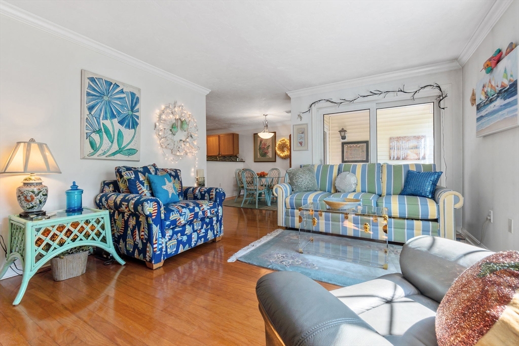 35 Collins Street, Unit 75 Danvers, MA 01923 - Photo 8 of 31 a bedroom with furniture and a wooden floor