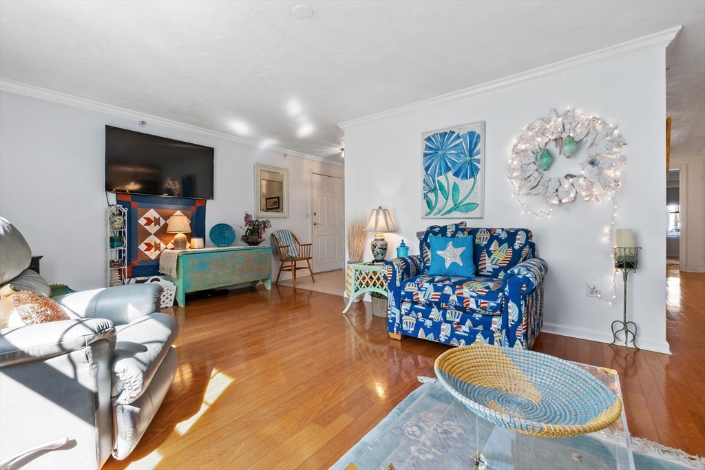 35 Collins Street, Unit 75 Danvers, MA 01923 - Photo 9 of 31 a living room with furniture and a flat screen tv