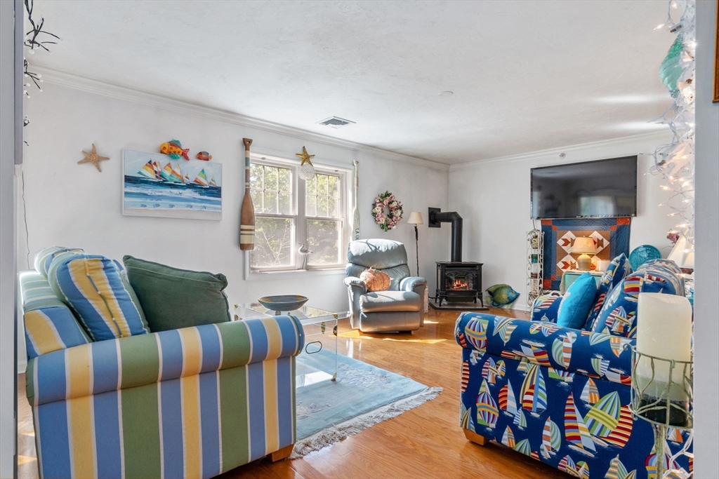 35 Collins Street, Unit 75 Danvers, MA 01923 - Photo 10 of 31 a living room with furniture and a flat screen tv