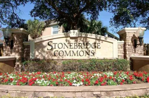 a view of sign board with flowers