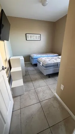 a bedroom with furniture and a window