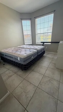 a bedroom with a bed and a window in it