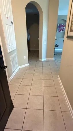 a view of a livingroom with an empty space and a fireplace