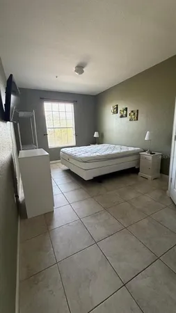 a spacious bathroom with a bathtub and window