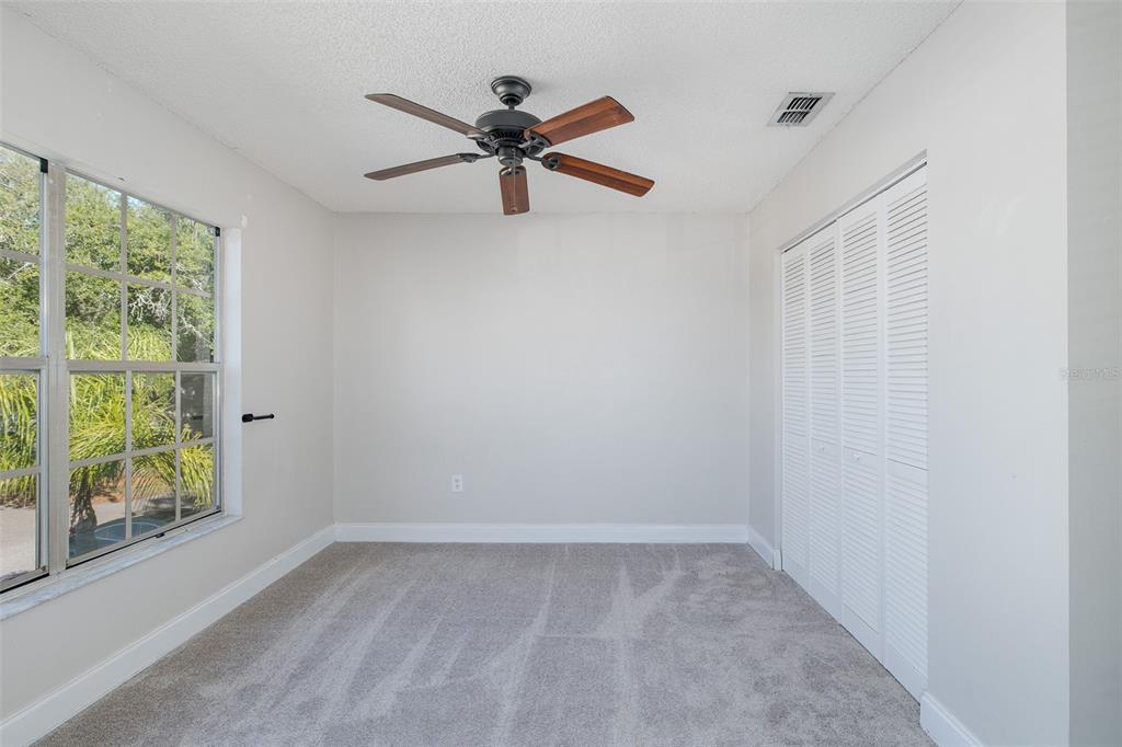 7900 Hardwick Drive, Unit 827 New Port Richey, FL 34653 - Photo 15 of 27 a view of a room with a window and a fan