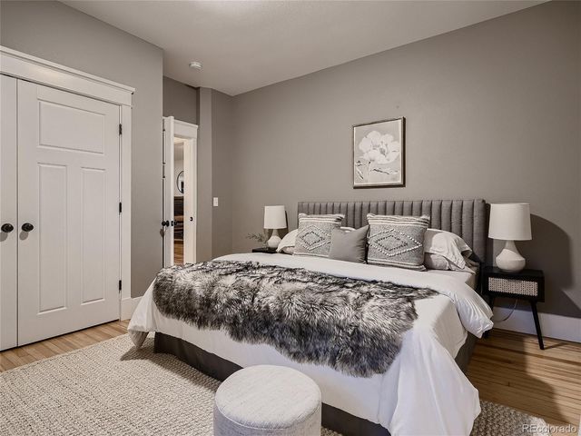 a bedroom with a bed and a table