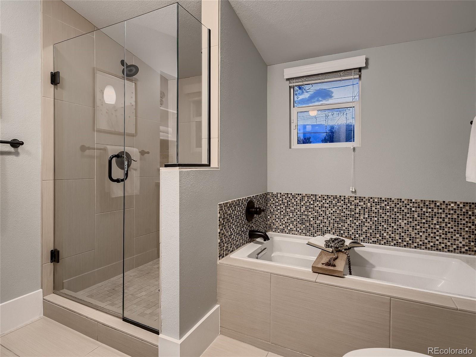 1031 Harrison Street Denver, CO 80206 - Photo 18 of 32 a bathroom with a shower