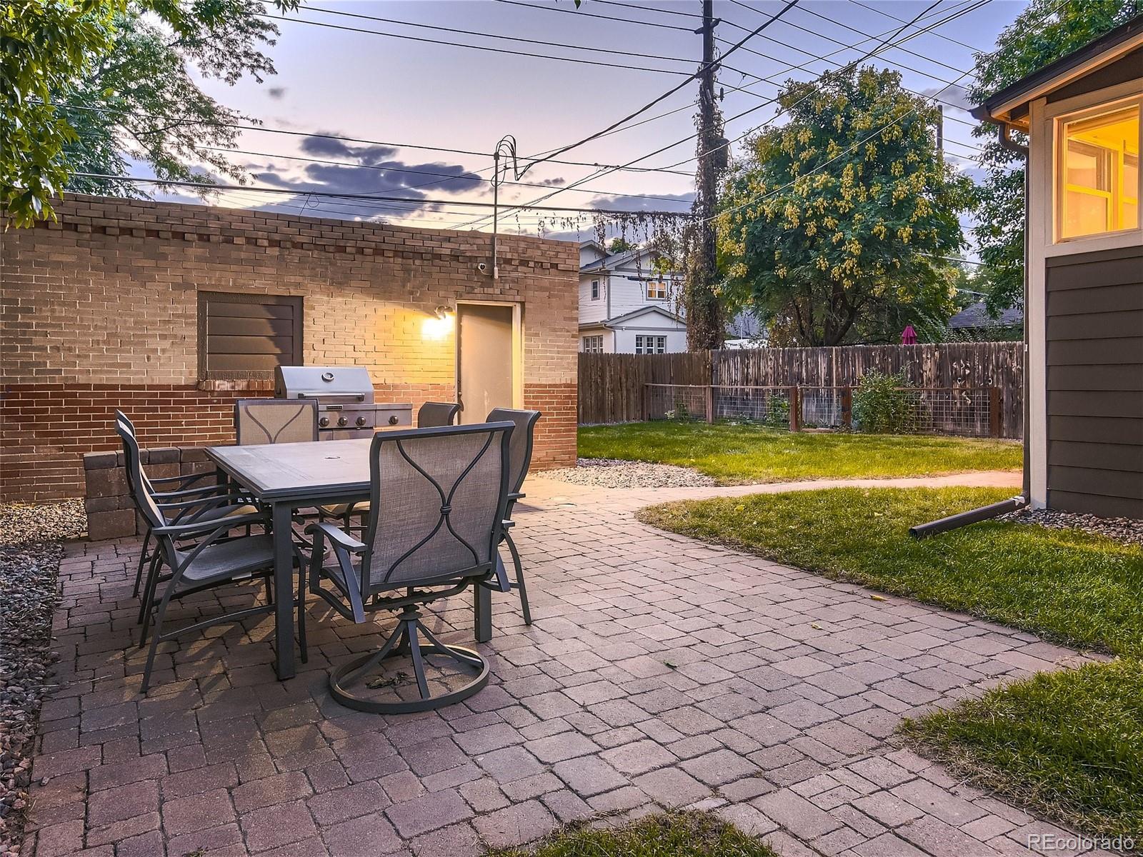 1031 Harrison Street Denver, CO 80206 - Photo 28 of 32 a view of a swimming pool with a patio and a yard