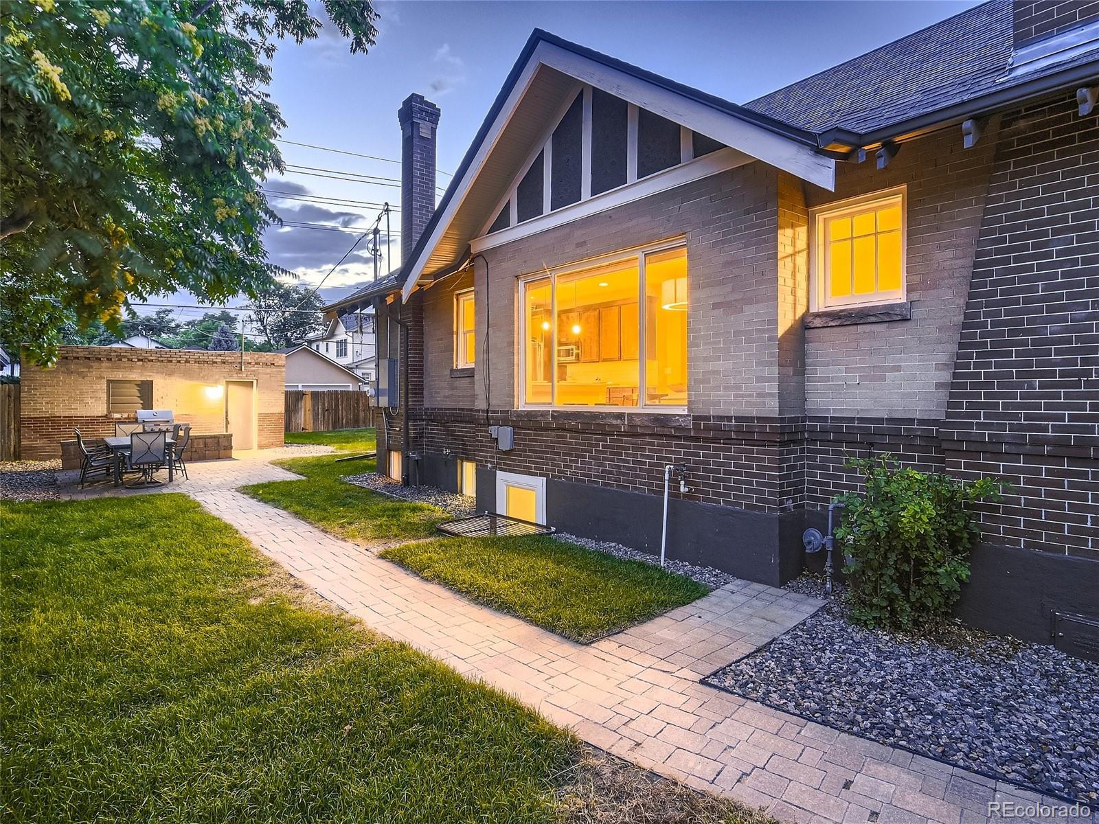 1031 Harrison Street Denver, CO 80206 - Photo 30 of 32 a front view of a house with a yard