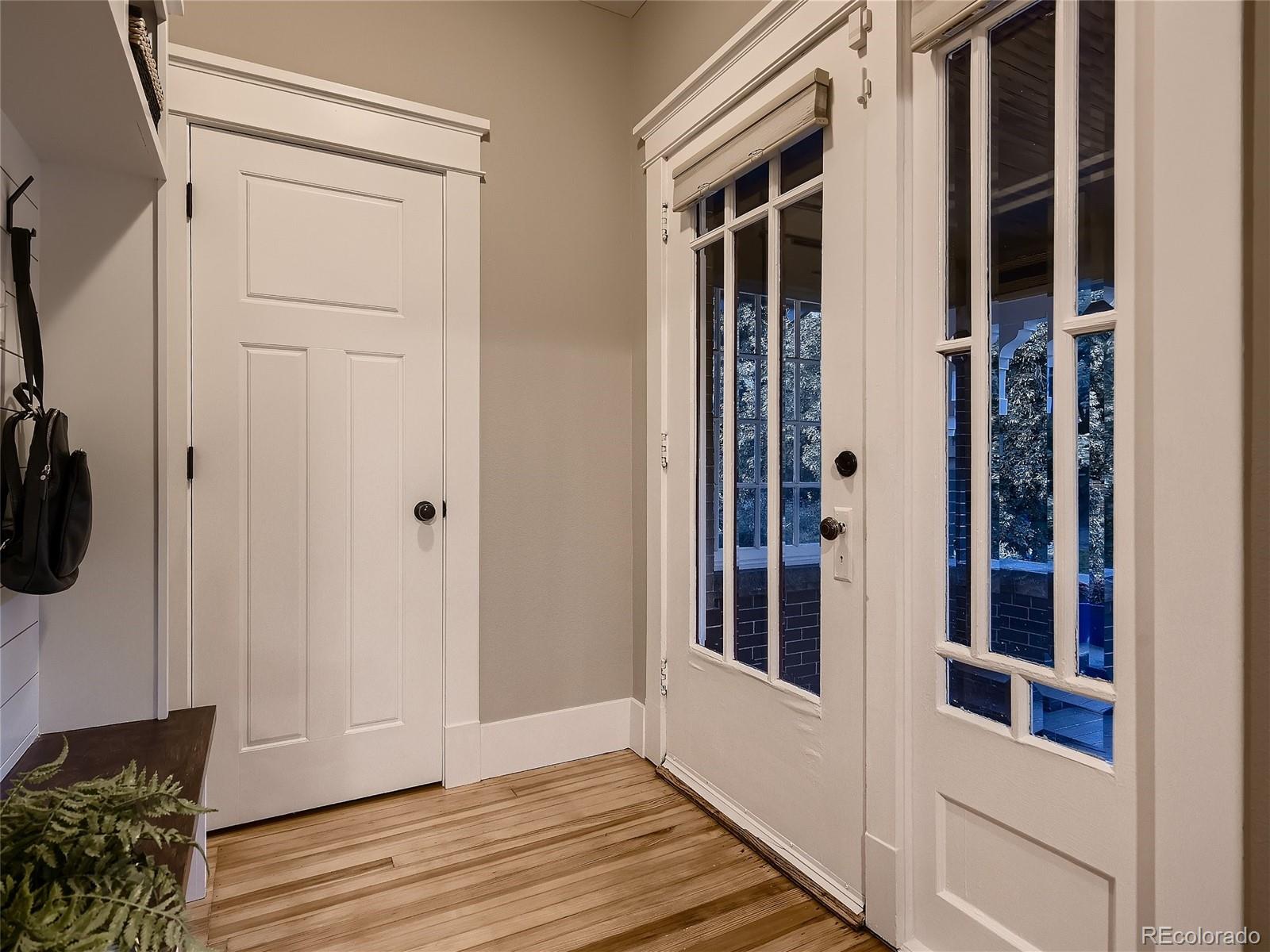 1031 Harrison Street Denver, CO 80206 - Photo 5 of 32 a view of a hallway with wooden floor and entryway