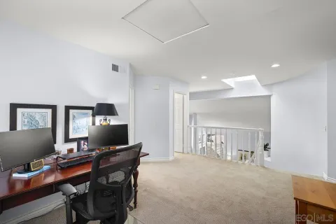 a workspace with furniture and a chandelier