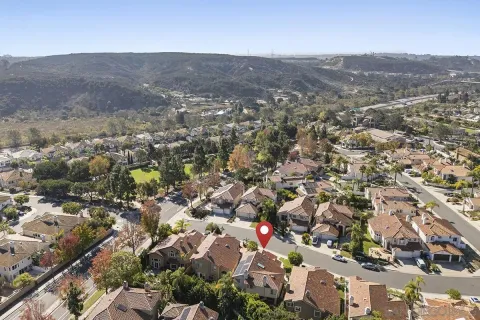 an aerial view of residential houses with outdoor space