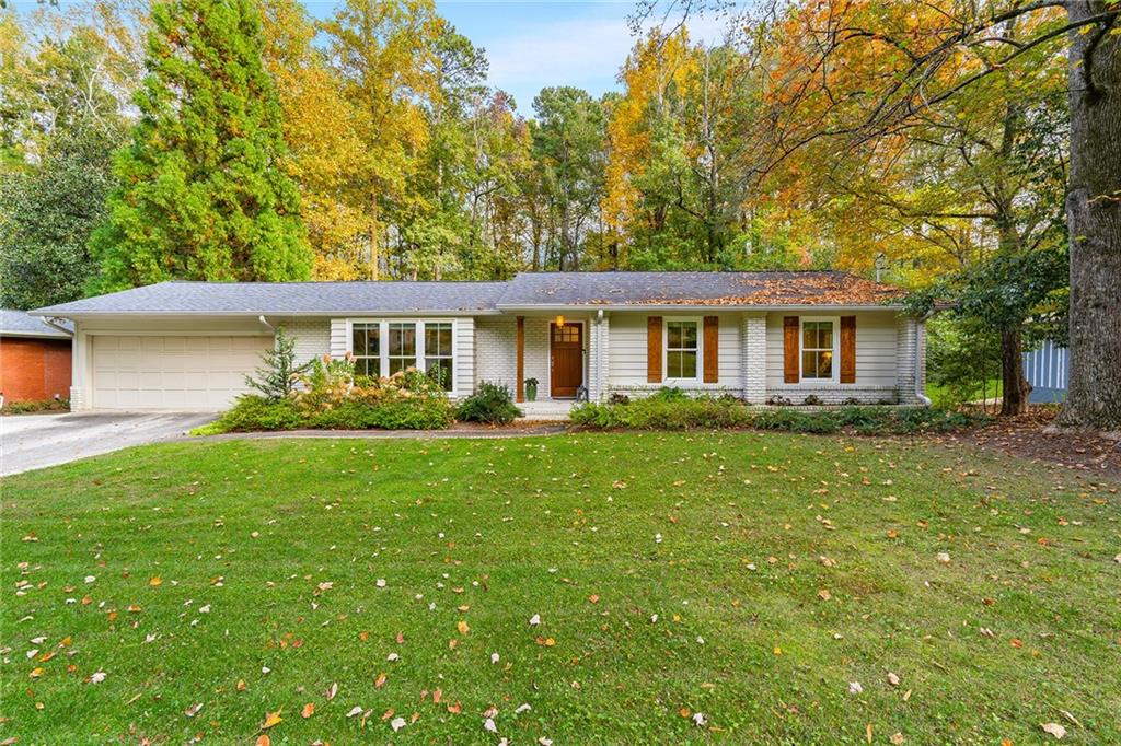 a view of a house with a backyard
