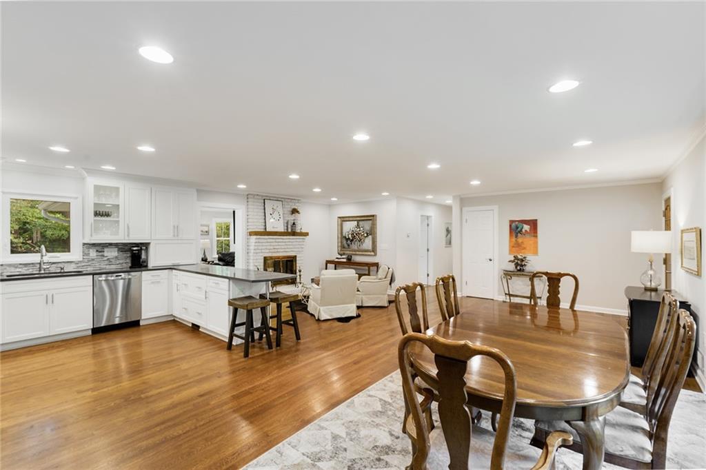 6555 Wright Road Northeast Sandy Springs, GA 30328 - Photo 12 of 40 a large kitchen with a table and chairs in it
