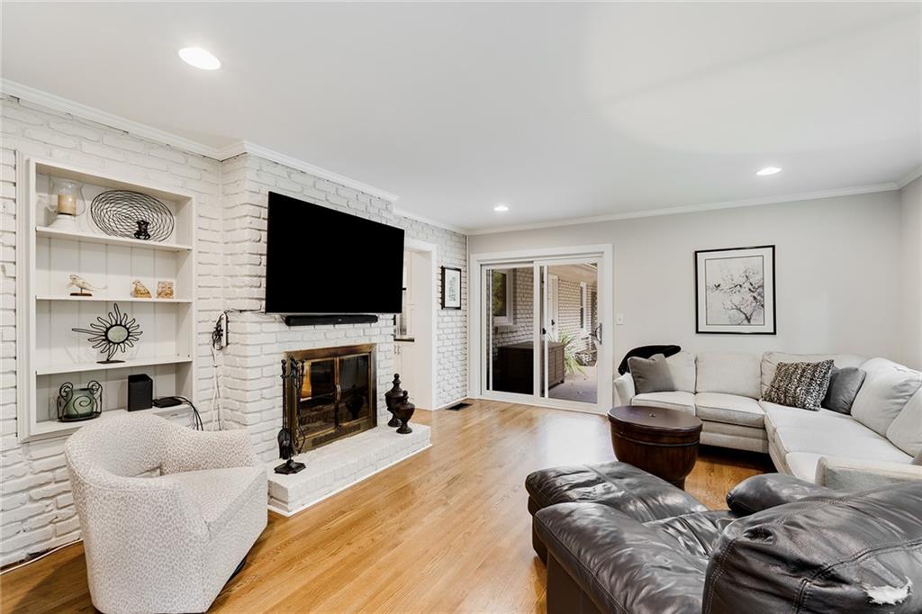 6555 Wright Road Northeast Sandy Springs, GA 30328 - Photo 14 of 40 a living room with fireplace furniture and a flat screen tv