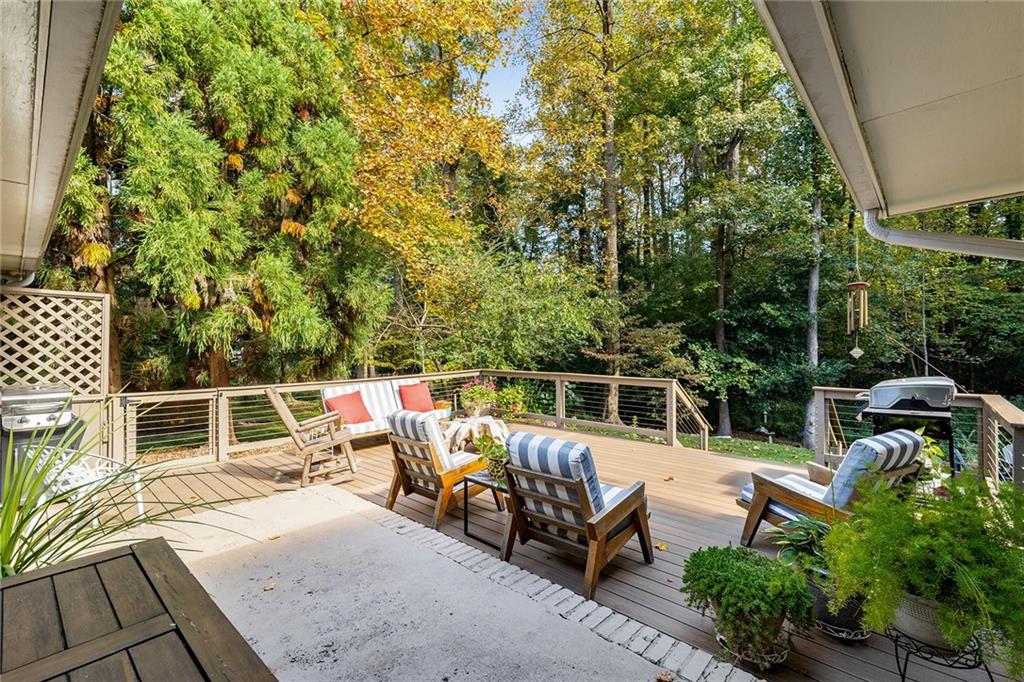 6555 Wright Road Northeast Sandy Springs, GA 30328 - Photo 27 of 40 a view of a patio with a table and chairs