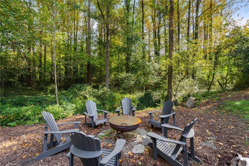 6555 Wright Road Northeast Sandy Springs, GA 30328 - Photo 32 of 40 a view of a patio with chairs and plants
