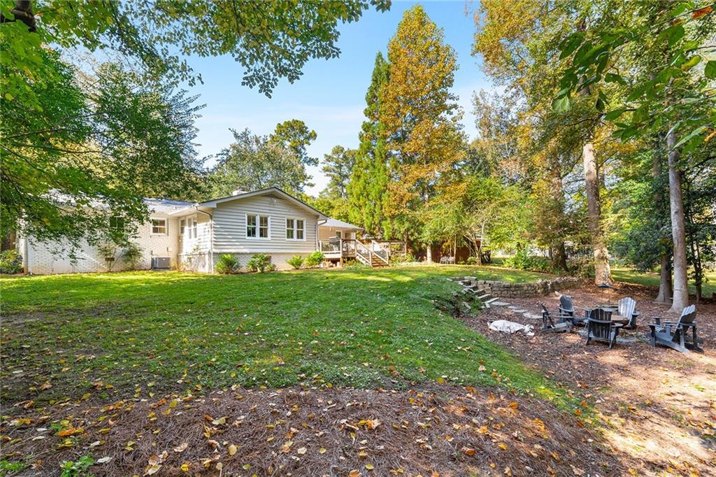 6555 Wright Road Northeast Sandy Springs, GA 30328 - Photo 34 of 40 a house view with a garden space