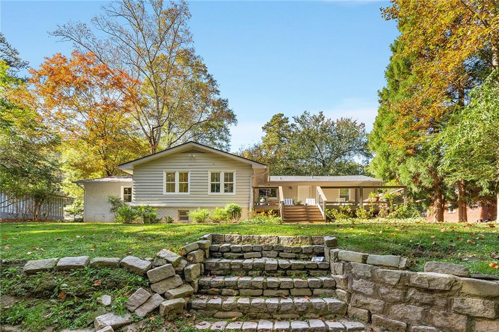 6555 Wright Road Northeast Sandy Springs, GA 30328 - Photo 35 of 40 a front view of a house with a yard