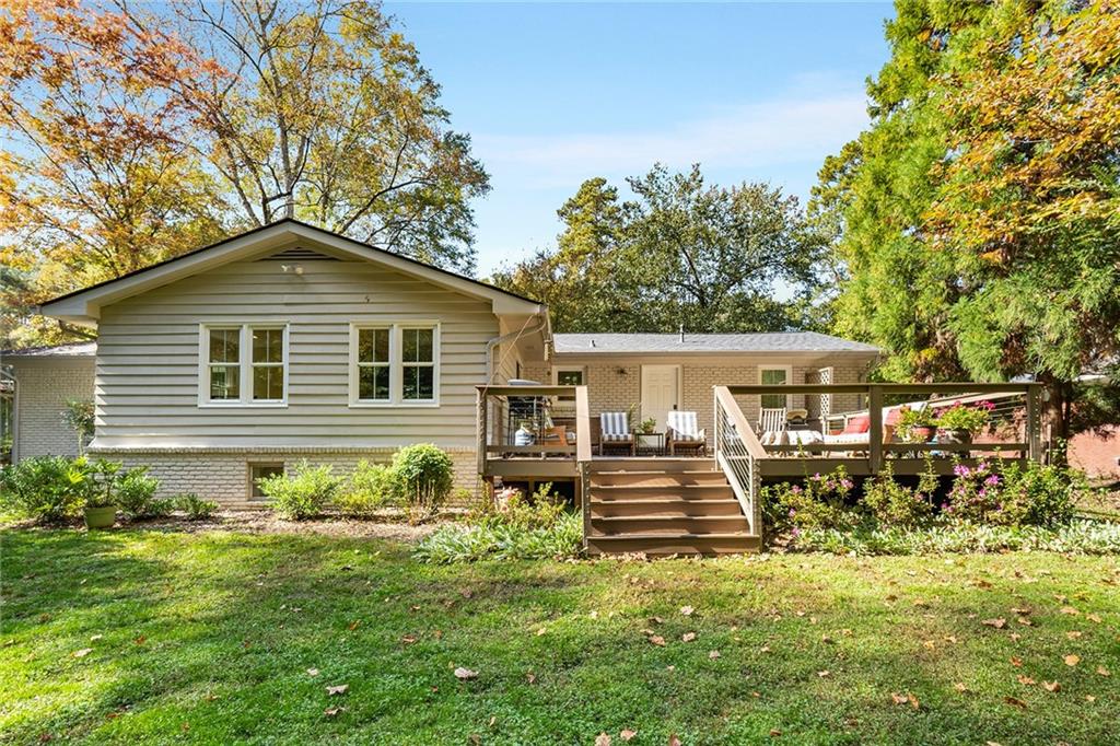 6555 Wright Road Northeast Sandy Springs, GA 30328 - Photo 36 of 40 a front view of a house with a yard