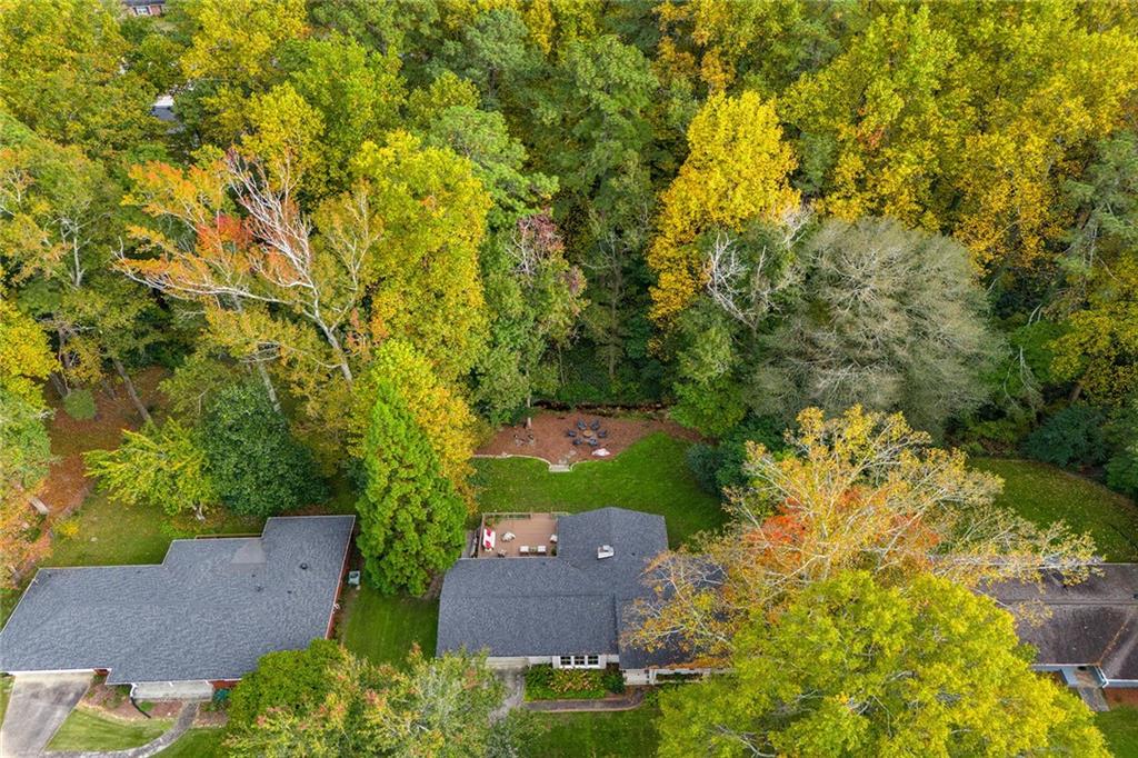 6555 Wright Road Northeast Sandy Springs, GA 30328 - Photo 38 of 40 an aerial view of a house with yard and outdoor seating