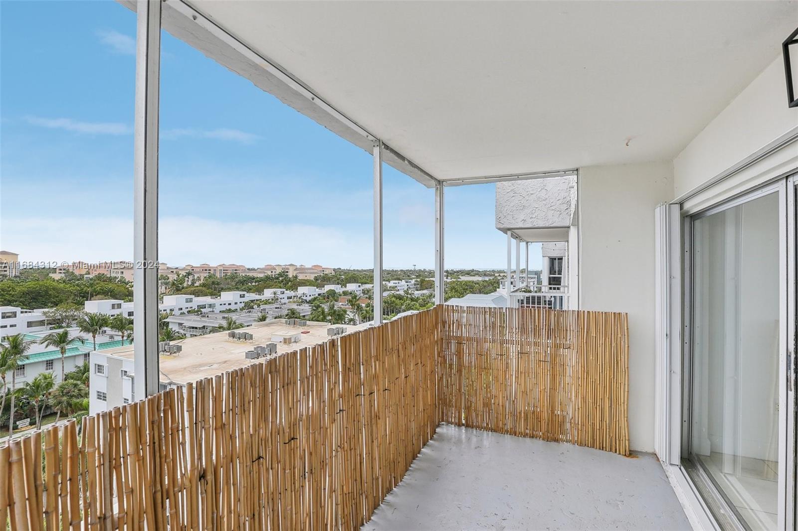 550 Ocean Drive, Unit 9F Key Biscayne, FL 33149 - Photo 17 of 37 a view of a balcony with wooden floor