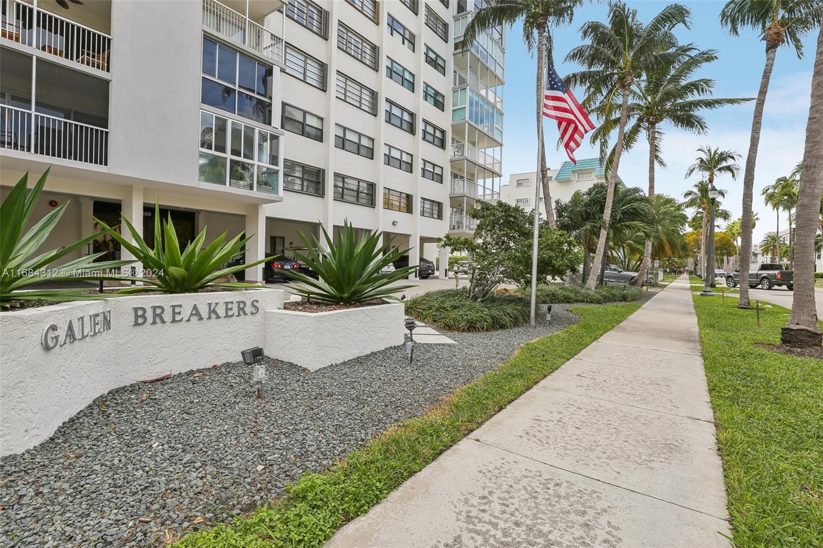 550 Ocean Drive, Unit 9F Key Biscayne, FL 33149 - Photo 2 of 37 a view of a palm trees in front of a building