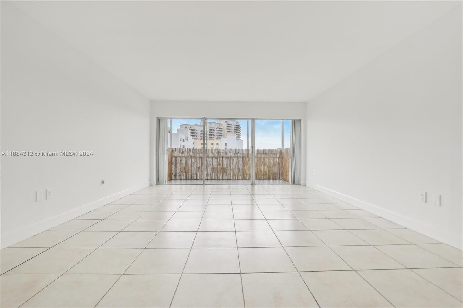 550 Ocean Drive, Unit 9F Key Biscayne, FL 33149 - Photo 23 of 37 a view of an empty room with a window