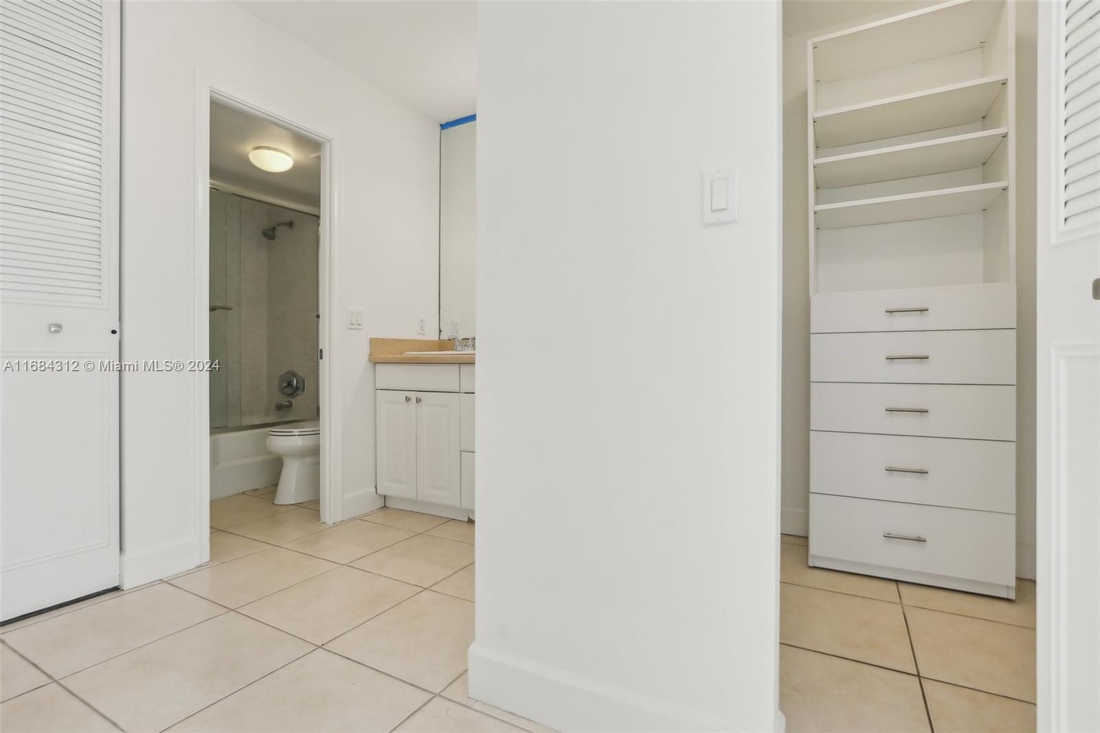 550 Ocean Drive, Unit 9F Key Biscayne, FL 33149 - Photo 5 of 37 a bathroom with a shower and a toilet