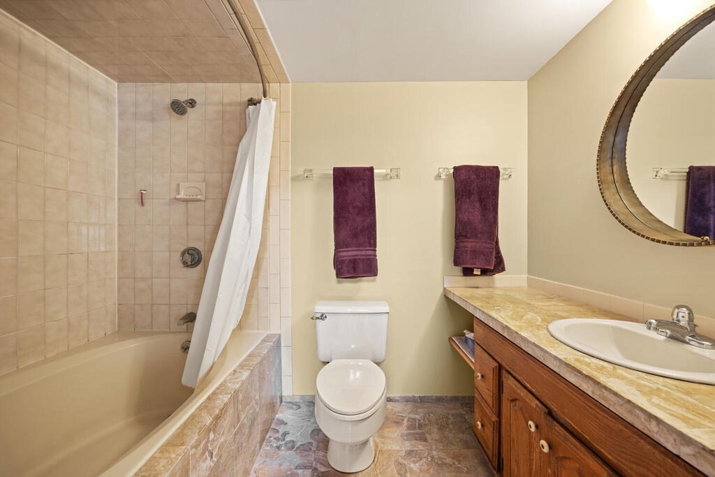 22 Spring Street Lexington, MA 02421 - Photo 19 of 35 a bathroom with a granite countertop toilet sink and mirror