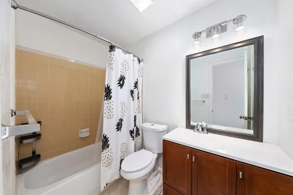 a bathroom with a sink a toilet and a bathtub