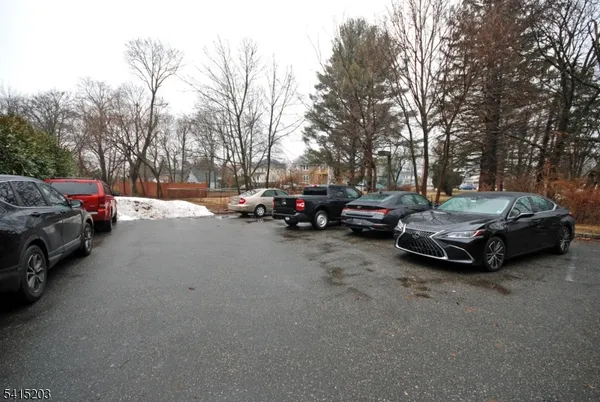 a view of street with parked cars