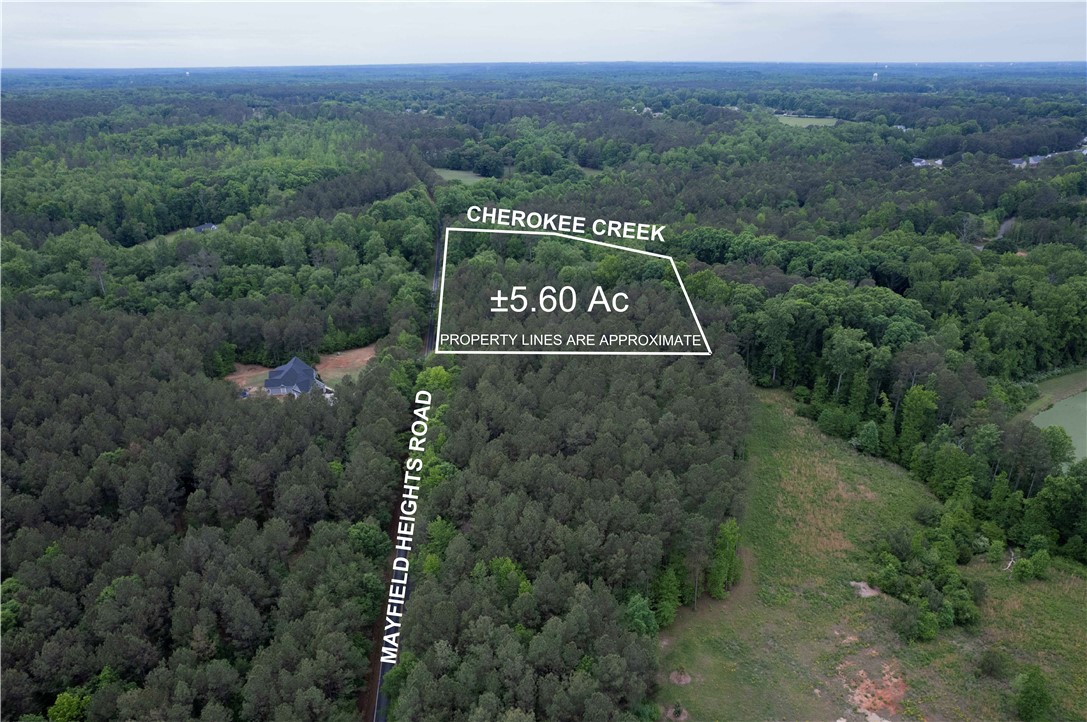 0 Mayfield Heights Road Belton, SC 29627 - Photo 2 of 6 This verdant expanse offers a secluded retreat amidst nature's embrace, featuring a tranquil creek.