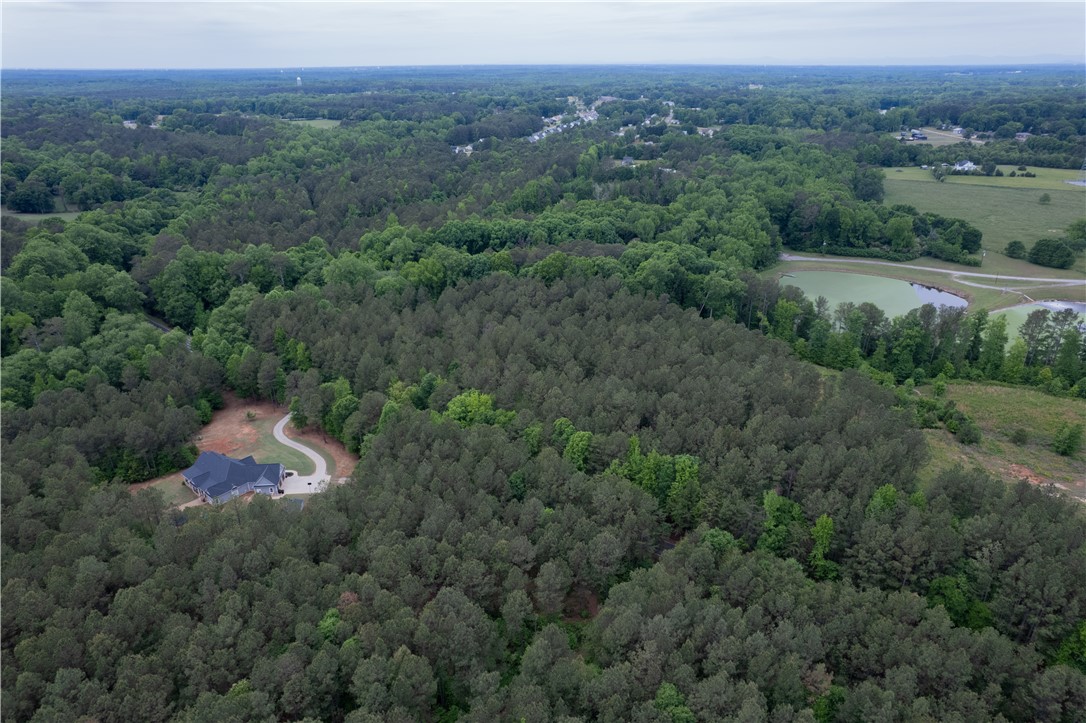 0 Mayfield Heights Road Belton, SC 29627 - Photo 6 of 6 This expansive aerial view showcases a secluded residence nestled within a lush, verdant landscape.