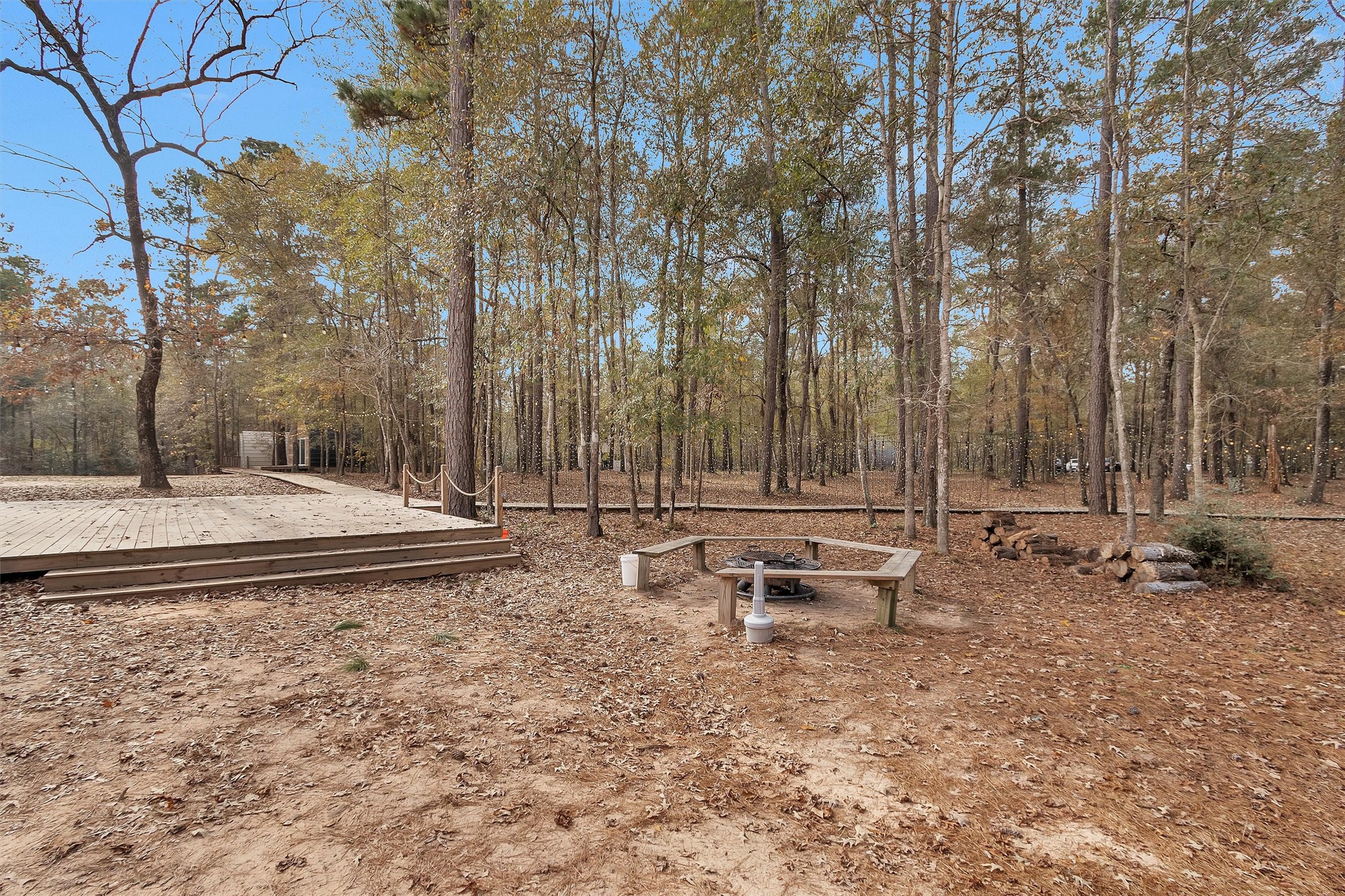 215 Fm 2929 Road Huntsville, TX 77340 - Photo 42 of 50 Large deck with paths and fire pit area