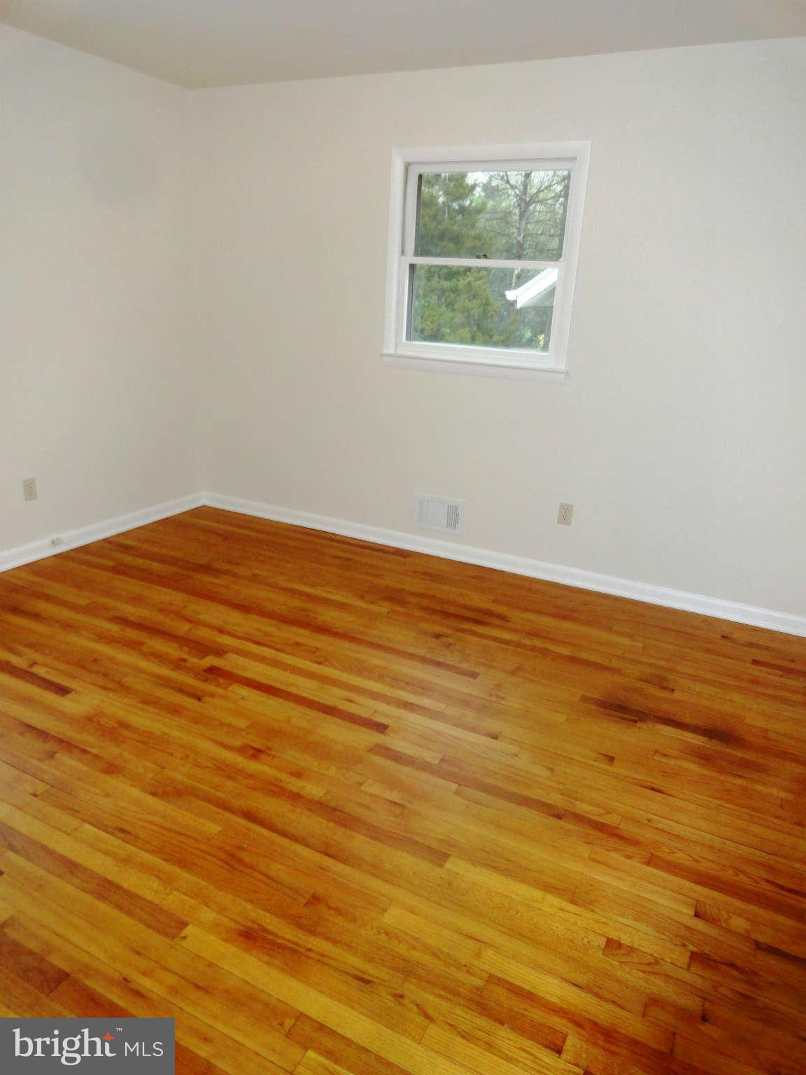 512 Shipley Road Linthicum Heights, MD 21090 - Photo 11 of 30 Refinished hardwood floors in all main level BRs