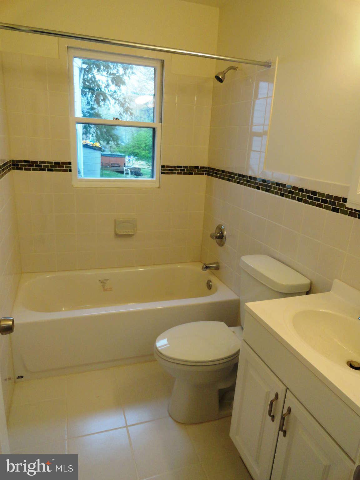 512 Shipley Road Linthicum Heights, MD 21090 - Photo 12 of 30 Completed new bathroom with decorative tile