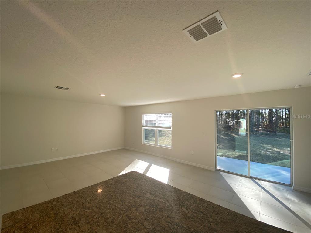 308 Hickory Course Radiel Ocala, FL 34472 - Photo 9 of 24 an empty room with windows