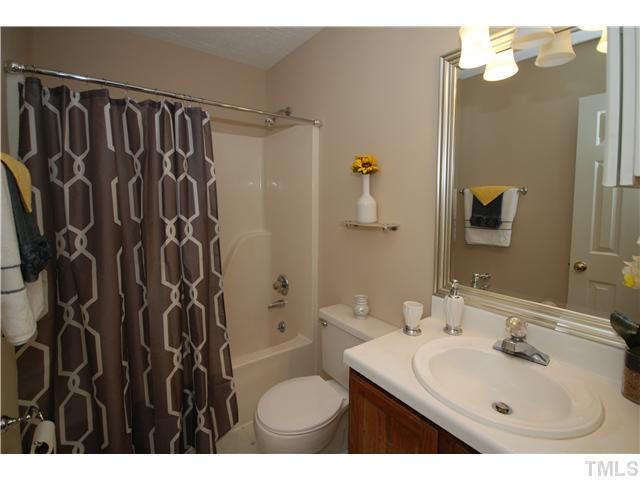7200 Ewing Place Raleigh, NC 27616 - Photo 20 of 25 a bathroom with a sink toilet and shower