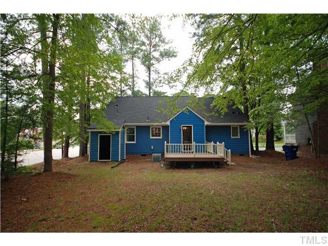 7200 Ewing Place Raleigh, NC 27616 - Photo 2 of 25 a front view of a house with a garden and tree