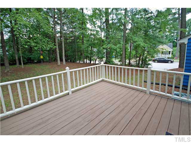 7200 Ewing Place Raleigh, NC 27616 - Photo 22 of 25 a wooden deck with trees in front of it