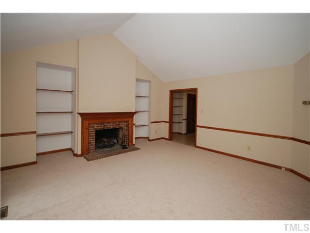 7200 Ewing Place Raleigh, NC 27616 - Photo 3 of 25 a view of empty room with a fireplace