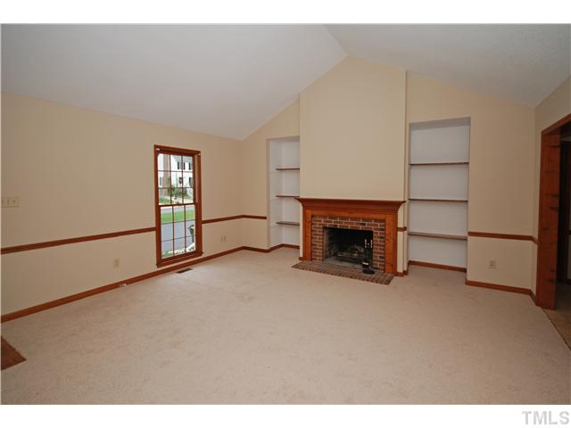 7200 Ewing Place Raleigh, NC 27616 - Photo 4 of 25 a view of an empty room with a fireplace