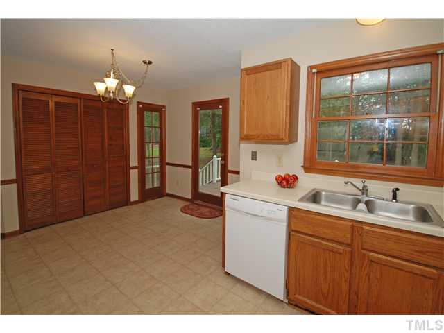 7200 Ewing Place Raleigh, NC 27616 - Photo 8 of 25 a kitchen that has a sink and a large window