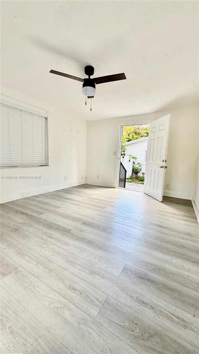 2238 Northwest 5th Street, Unit 1 Miami, FL 33125 - Photo 15 of 18 a view of a room with wooden floor