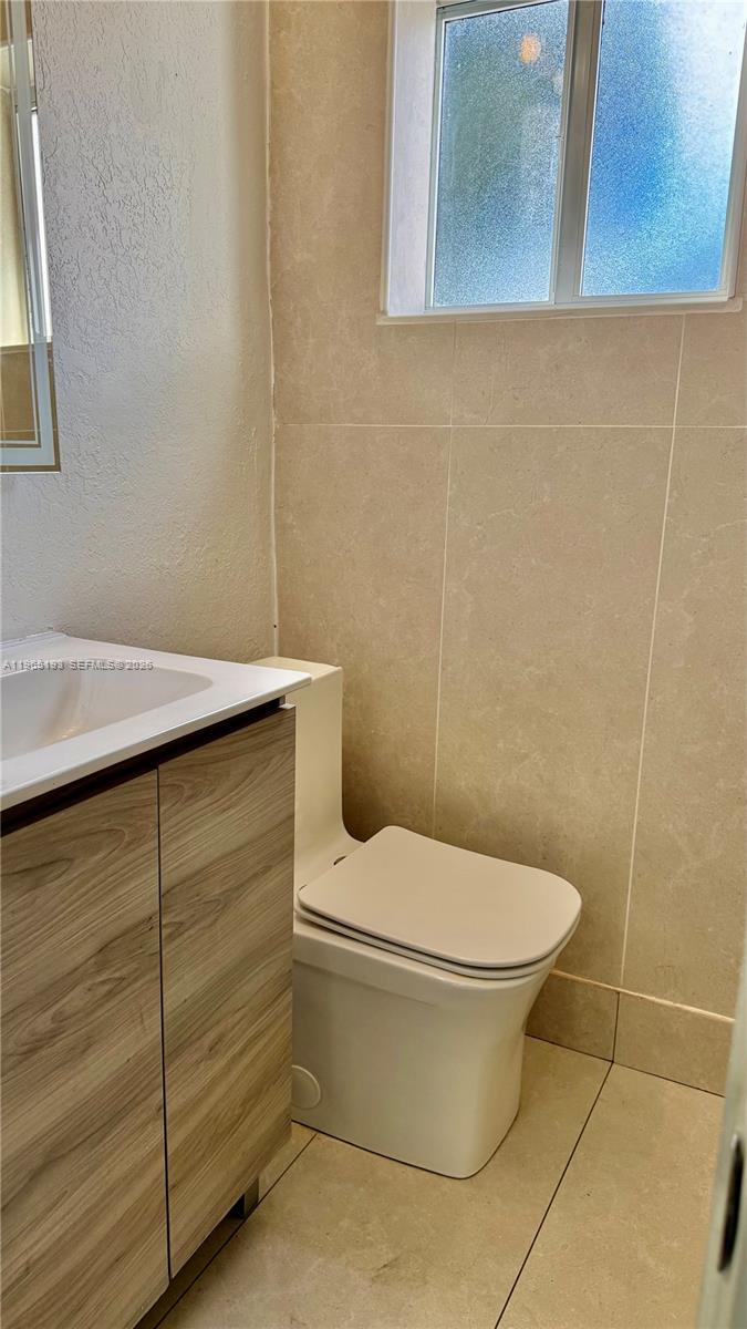 2238 Northwest 5th Street, Unit 1 Miami, FL 33125 - Photo 10 of 18 a bathroom with a toilet and a sink